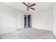 Spacious bedroom with ceiling fan and carpeted floor at 2209 Donnabrook Ln, Gastonia, NC 28052