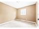 Tan bedroom with a window and carpeted floor at 2209 Donnabrook Ln, Gastonia, NC 28052