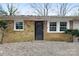 Brick front exterior with black door and landscaping at 2209 Donnabrook Ln, Gastonia, NC 28052