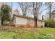 Brick and vinyl-sided home with sloping backyard at 2209 Donnabrook Ln, Gastonia, NC 28052