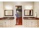 Double vanity bathroom with granite countertops and large mirrors at 252 Bay Shore Loop, Mooresville, NC 28117