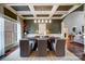 Elegant dining room features a large table, coffered ceiling, and hardwood floors at 252 Bay Shore Loop, Mooresville, NC 28117