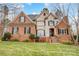 Brick front elevation of two-story home with stone accents and landscaping at 252 Bay Shore Loop, Mooresville, NC 28117