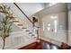 Bright foyer with hardwood floors, staircase, and white wainscoting at 252 Bay Shore Loop, Mooresville, NC 28117