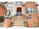 Elegant front entry with stone steps and black front door at 252 Bay Shore Loop, Mooresville, NC 28117