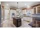 Kitchen features granite island, custom cabinetry, and brick wall at 252 Bay Shore Loop, Mooresville, NC 28117