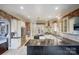 Modern kitchen with granite countertops and stainless steel appliances at 252 Bay Shore Loop, Mooresville, NC 28117