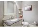 Stylish powder room with ornate vanity and marble countertop at 252 Bay Shore Loop, Mooresville, NC 28117