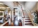 Grand staircase with wooden railing and hardwood floors at 252 Bay Shore Loop, Mooresville, NC 28117