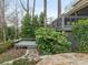 Landscaped backyard with stone path and deck at 2540 Ballencourt Ln, Charlotte, NC 28226