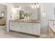 Double vanity bathroom with granite countertops and white cabinets at 2540 Ballencourt Ln, Charlotte, NC 28226