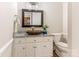 Updated bathroom with granite countertop, copper sink, and white cabinets at 2540 Ballencourt Ln, Charlotte, NC 28226