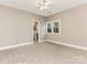 Bright bedroom with carpet, access to bathroom, and window at 2540 Ballencourt Ln, Charlotte, NC 28226