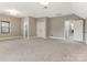 Spacious bedroom with carpet, and access to other rooms at 2540 Ballencourt Ln, Charlotte, NC 28226