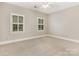 Spacious bedroom with neutral carpeting and large windows at 2540 Ballencourt Ln, Charlotte, NC 28226