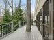 Large deck wraps around tree, offering a screened porch and stairs at 2540 Ballencourt Ln, Charlotte, NC 28226