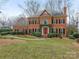 Brick front of charming two-story home with lush landscaping at 2540 Ballencourt Ln, Charlotte, NC 28226