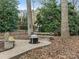 Cozy fire pit area with benches in the backyard at 2540 Ballencourt Ln, Charlotte, NC 28226