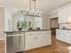 Spacious kitchen with large island, granite countertops, and white cabinets at 2540 Ballencourt Ln, Charlotte, NC 28226