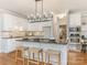 Modern kitchen with large island, stainless steel appliances, and white cabinets at 2540 Ballencourt Ln, Charlotte, NC 28226