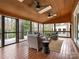 Relaxing screened porch with ceiling fans and wooden flooring at 2540 Ballencourt Ln, Charlotte, NC 28226