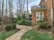 Flagstone pathway leads to home's back patio and deck at 2540 Ballencourt Ln, Charlotte, NC 28226