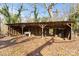 Open-air barn with wooden beams and stone fireplace at 2948 W Main St, Claremont, NC 28610