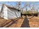 Rustic white barn with large doors and adjacent covered structure at 2948 W Main St, Claremont, NC 28610