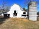 White barn with silo, offering ample storage at 2948 W Main St, Claremont, NC 28610