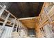 Expansive barn interior featuring wooden framework, high vaulted ceilings and stacked hay bales at 2948 W Main St, Claremont, NC 28610