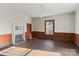 Simple bedroom with hardwood floors and wood walls at 2948 W Main St, Claremont, NC 28610