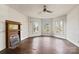 Bright bedroom with hardwood floors, wood paneling, and large windows at 2948 W Main St, Claremont, NC 28610