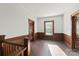 Simple bedroom with hardwood floors and wood walls at 2948 W Main St, Claremont, NC 28610