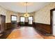 Formal dining room showcasing hardwood floors and stained wood details at 2948 W Main St, Claremont, NC 28610