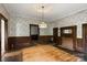 Spacious dining room featuring hardwood floors, stained wood trim, and a brick fireplace at 2948 W Main St, Claremont, NC 28610