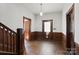 Entryway with hardwood floors and wood staircase at 2948 W Main St, Claremont, NC 28610