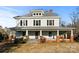 Two-story farmhouse with wrap-around porch at 2948 W Main St, Claremont, NC 28610