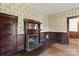 Fireplace with wooden mantel and mirror, in a room with wood paneling at 2948 W Main St, Claremont, NC 28610