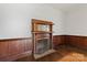 Simple fireplace with wood mantel and metal screen at 2948 W Main St, Claremont, NC 28610