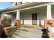 Charming front porch with brick columns and wooden steps at 2948 W Main St, Claremont, NC 28610