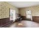 Living room with hardwood floors and vintage wallpaper at 2948 W Main St, Claremont, NC 28610