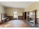 Spacious living room featuring hardwood floors, a fireplace, and large windows at 2948 W Main St, Claremont, NC 28610