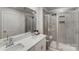 Modern bathroom with white vanity, gray tile, and glass shower at 3021 Belstock Ct, Charlotte, NC 28216