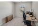 Home office with a standing desk and ergonomic chair at 3021 Belstock Ct, Charlotte, NC 28216