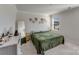 Spacious bedroom with full bed and large mirror at 3021 Belstock Ct, Charlotte, NC 28216