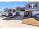 Townhome exterior with attached garage and landscaping at 3021 Belstock Ct, Charlotte, NC 28216