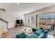 Living room with green couch and sliding glass doors at 3021 Belstock Ct, Charlotte, NC 28216