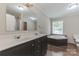 Elegant bathroom featuring a soaking tub, double vanity sinks, and classic finishes at 3035 Agean Ln, York, SC 29745