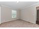 Bedroom with neutral carpet and walls, and a window at 3035 Agean Ln, York, SC 29745