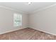 Bedroom with neutral carpet and walls, window, and a ceiling-mounted light fixture at 3035 Agean Ln, York, SC 29745